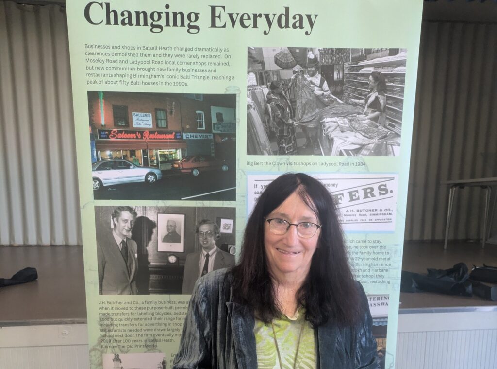Judith at the exhibition brings her Balsall Heath poetry