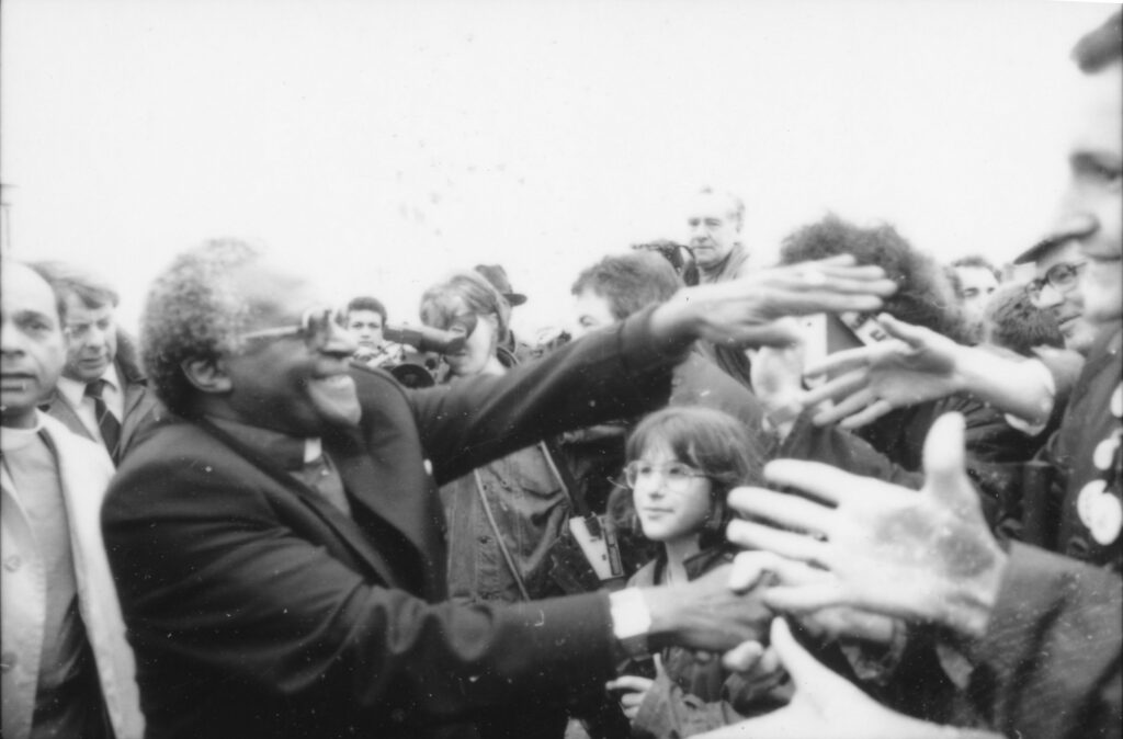 Archbishop Desmond Tutu greets the crowd